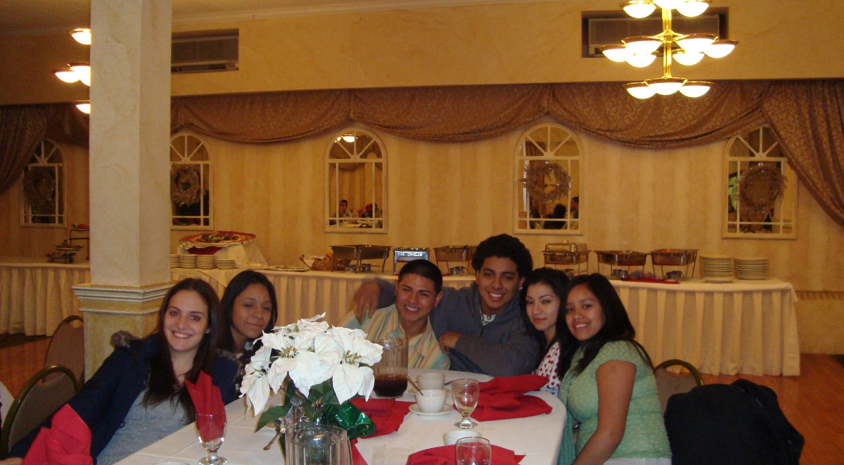 A group of people posing for a picture at a table.