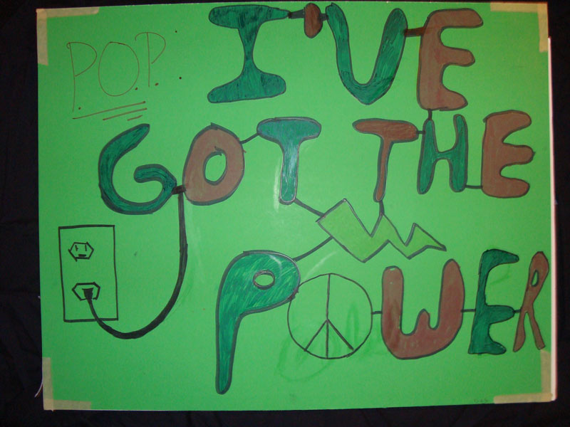 A green sign that says i've got the power.