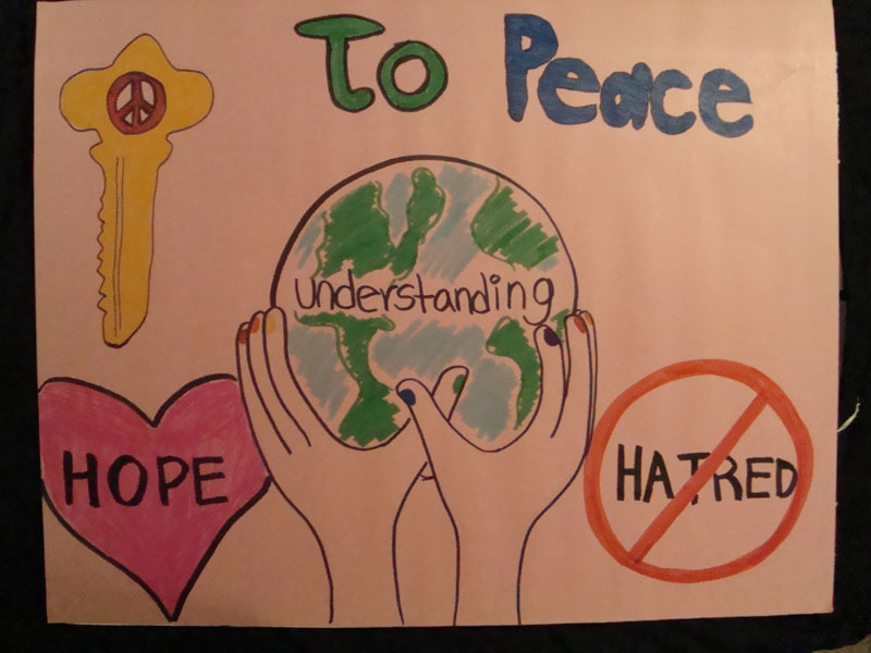 A poster with the words to peace, hope, and hate.