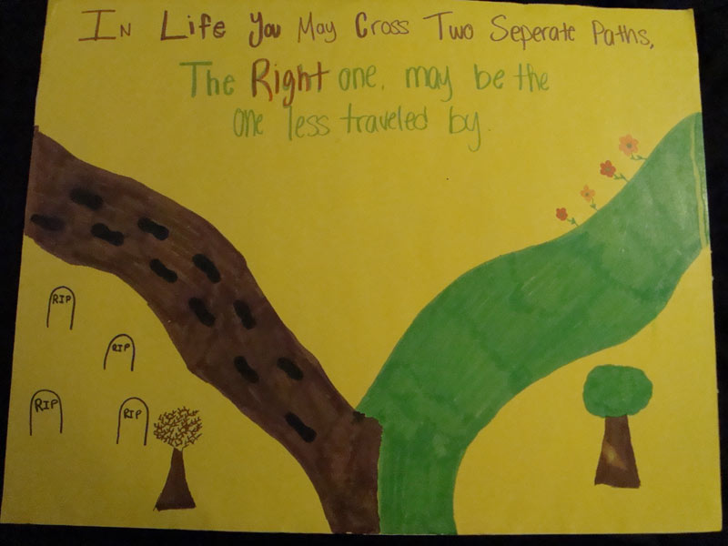 A child's drawing of a tree and a road.