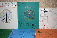 A group of children's drawings on a table.