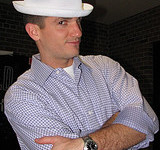 A man wearing a white hat.