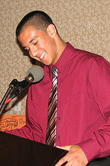 A man standing in front of a microphone.