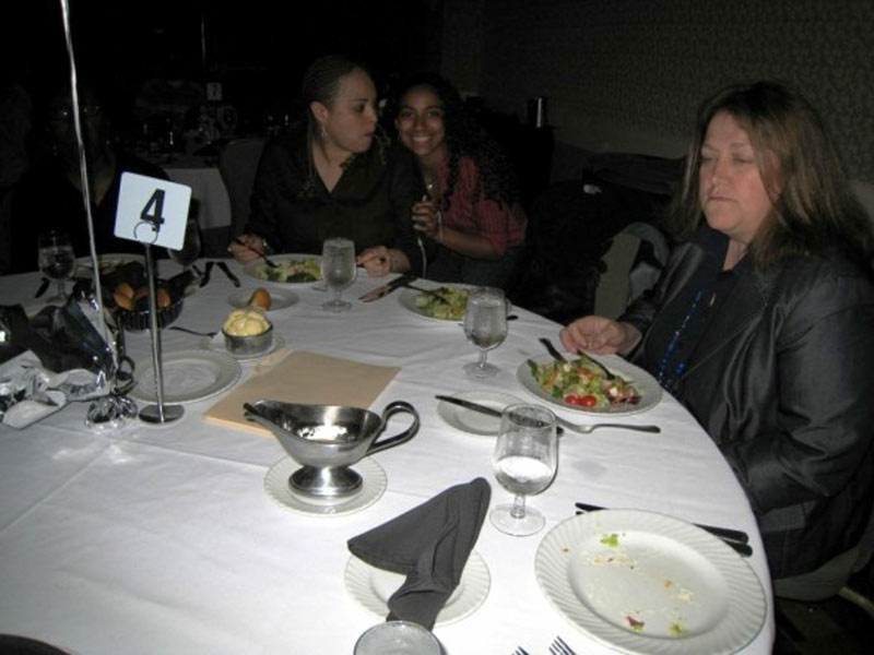 A group of women sitting at a table.