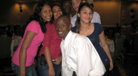 A group of people posing for a picture at a party.