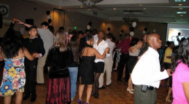 A group of people dancing at a party.