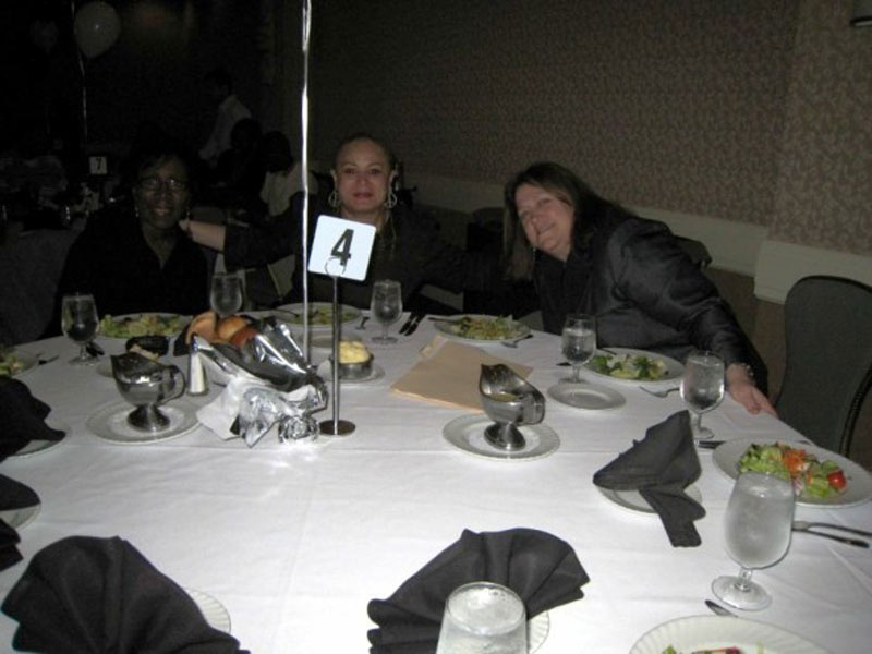 A group of people sitting at a table.
