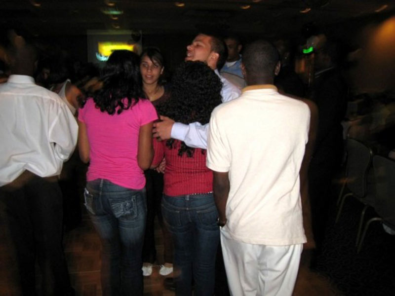 A group of people standing together at a party.