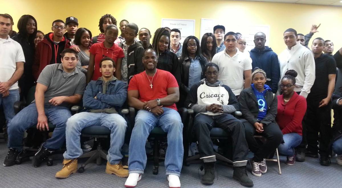 A group of people posing for a photo in an office.